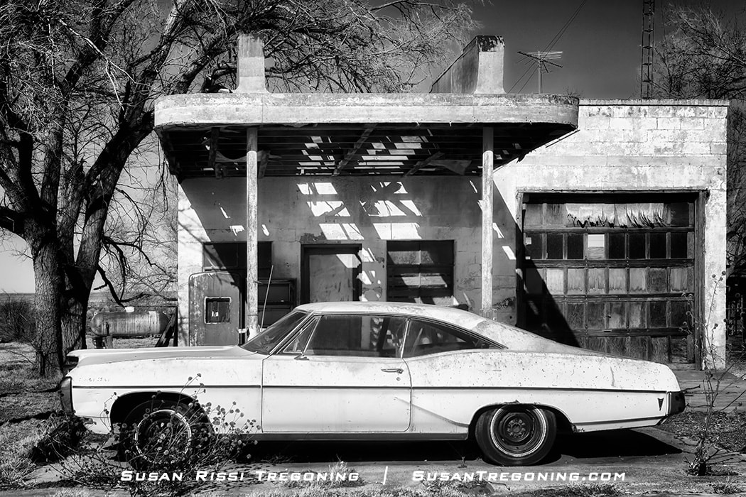 A 1968 Pontiac Catalina sits in front of the dilapidated Texaco Service Station in the ghost town of Glenrio, Texas. 
