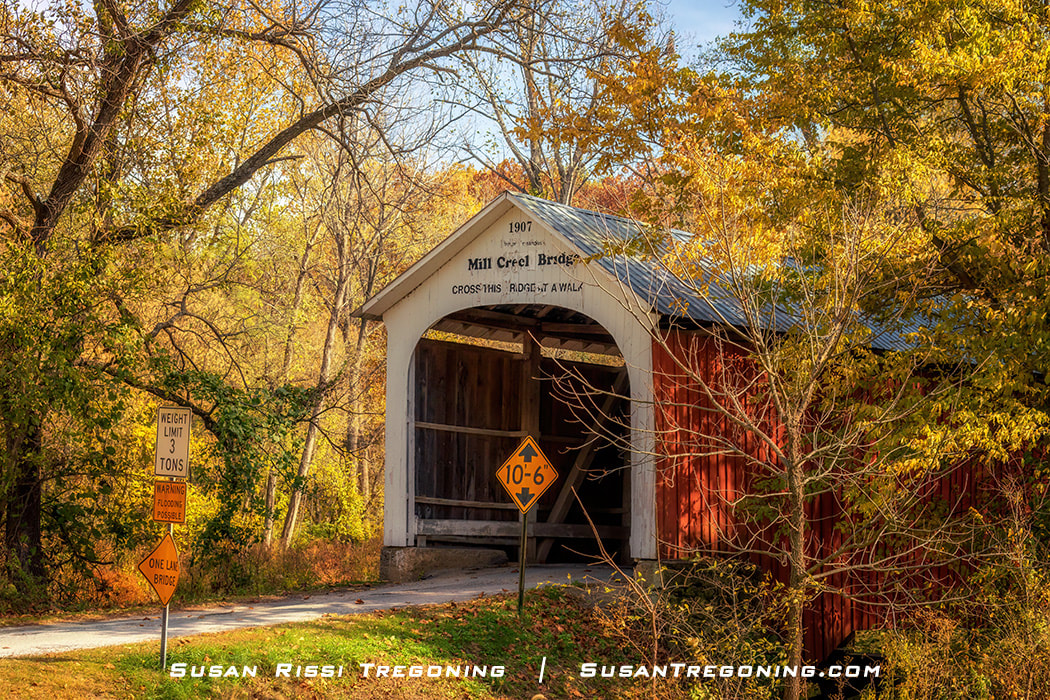 Autumn at the Mill Creek Covered Bridge located southwest of Tangier, Indiana, one of Parke County, Indiana’s 31 covered bridges.