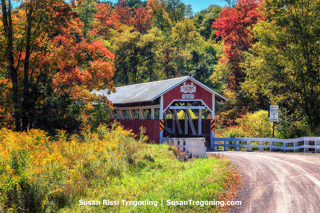 Beautiful fall foliage surrounds the Glessner Covered Bridge in Somerset County, Pennsylvania.