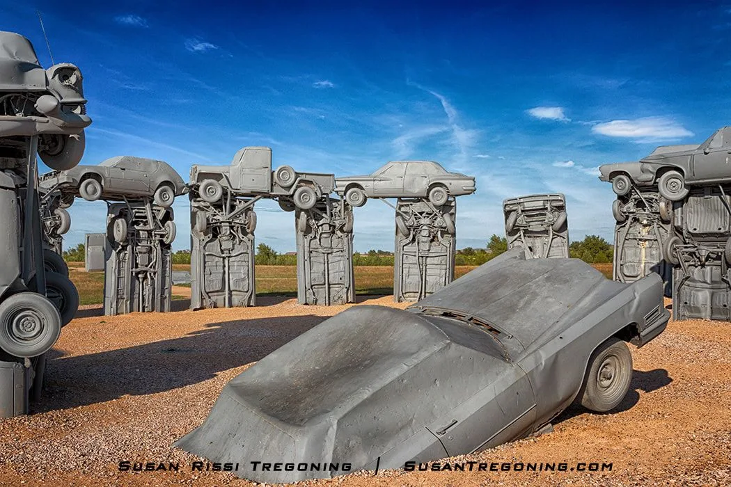 A 1962 Cadillac painted gray stands upright at the center of Carhenge, serving as the site’s heelstone against an open Nebraska sky.