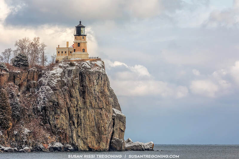 Looking up at the historic Split Rock Lighthouse on a beautiful snowy day, the lighthouse sits 130 feet above Lake Superior on the edge of Stony Point. 