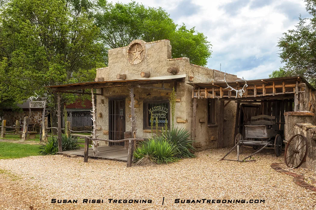 The office of Marshal Ralph Hooker. The Marshal's office is new construction built in 1993 as a museum to house Marshal Hooker's guns, badges, and other items he used during his 50 years of law enforcement. The office of Marshal Ralph Hooker. The Marshal's office is new construction built in 1993 as a museum to house Marshal Hooker's guns, badges, and other items he used during his 50 years of law enforcement.