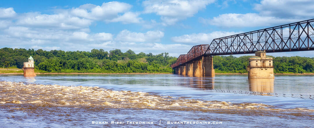 The Mississippi River seen below the Old Chain of Rocks Bridge near the Chain of Rocks shoal and the historic St. Louis water intake towers, with the shoal now visible only when river levels are extremely low due to the low‑water dam.