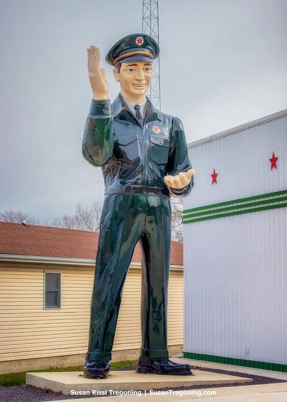 A rare 24‑foot‑tall Texas Big Friend Giant from 1967 stands beside the American Giants Museum on the 1926 alignment of Route 66 in Atlanta, Illinois. The fiberglass figure, originally installed at a Texaco station in Las Vegas, was acquired in 2016 and restored in 2024.