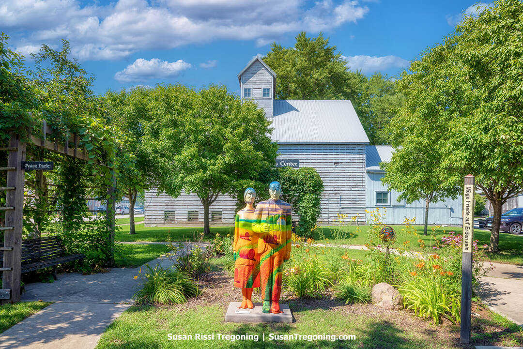 Beside the Amana Colonies Visitor Center in the middle of Peace Park in Amana, Iowa, you’ll find a statue of the renowned American Gothic couple. This artwork is part of the Iowa “Overalls All Over” campaign, a public art project organized by Go Cedar Rapids, Black Earth Gallery, and Czech Village New Bohemia Main Street.