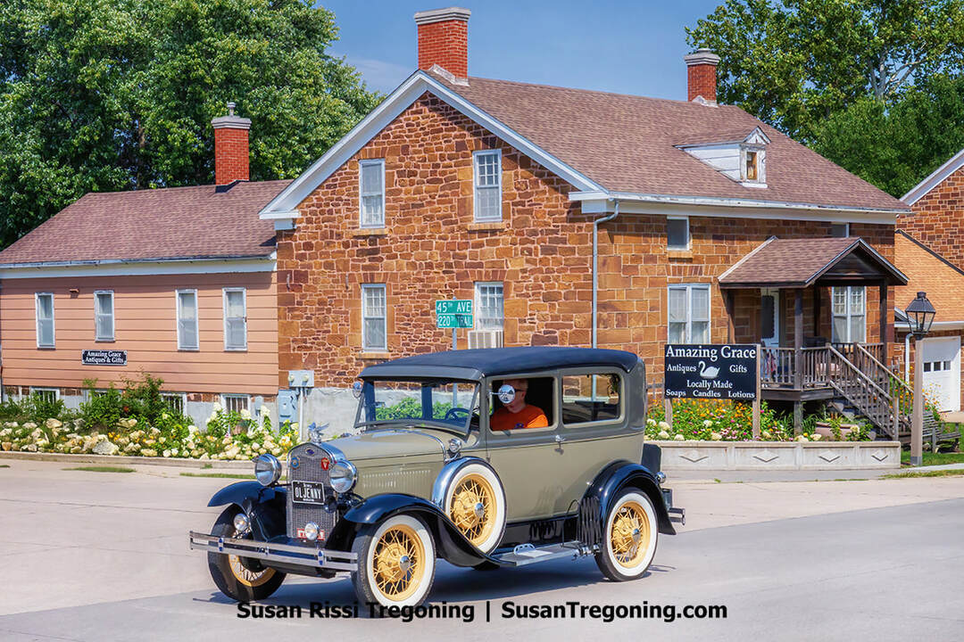 Against the backdrop of the historic 1857 Christian Metz Home, a Ford Model A makes its way along Amana’s main street, marking the conclusion of Iowa Model A Day in the Amana Colonies.
