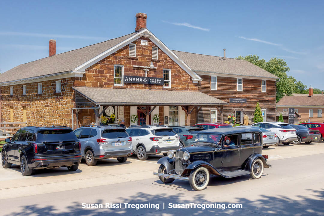 A Ford Model A makes its way past the Amana General Store, marking the conclusion of Iowa Model A Day in the Amana Colonies.