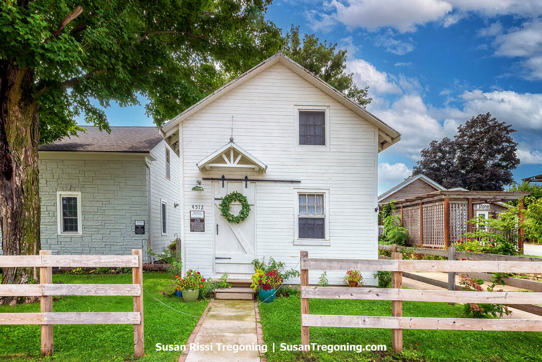 The historic simple white wooden Farm Manager's Office downtown, Amana, Iowa.