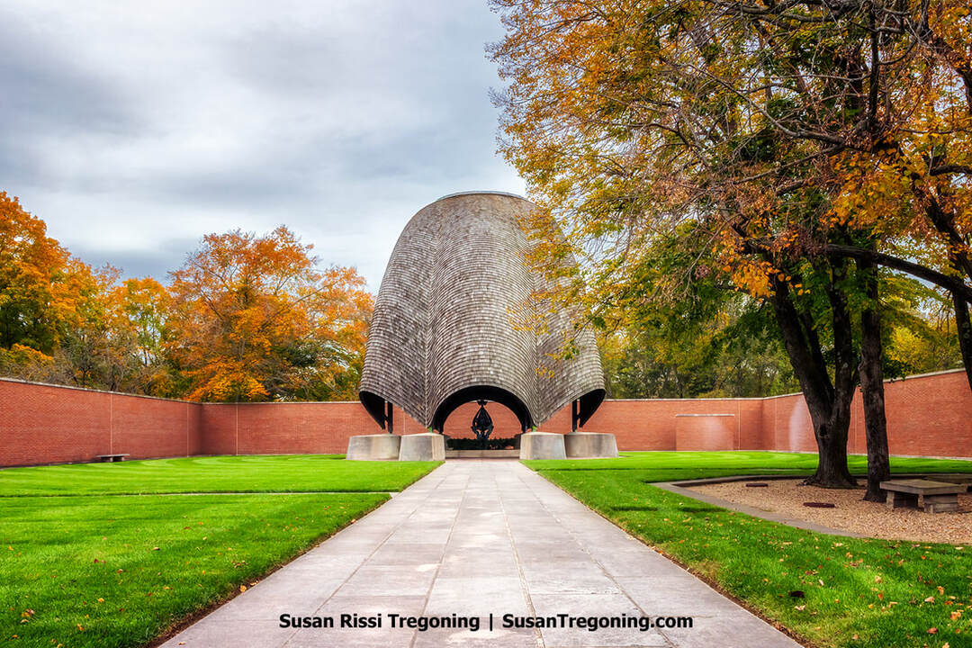 An autumn view inside Philip Johnson’s Roofless Church in New Harmony, Indiana. At the heart of the complex stands a shingled canopy shaped like an inverted rosebud, which shelters a major Cubist bronze by Jewish sculptor Jacques Lipchitz called the Descent of the Holy Spirit. 