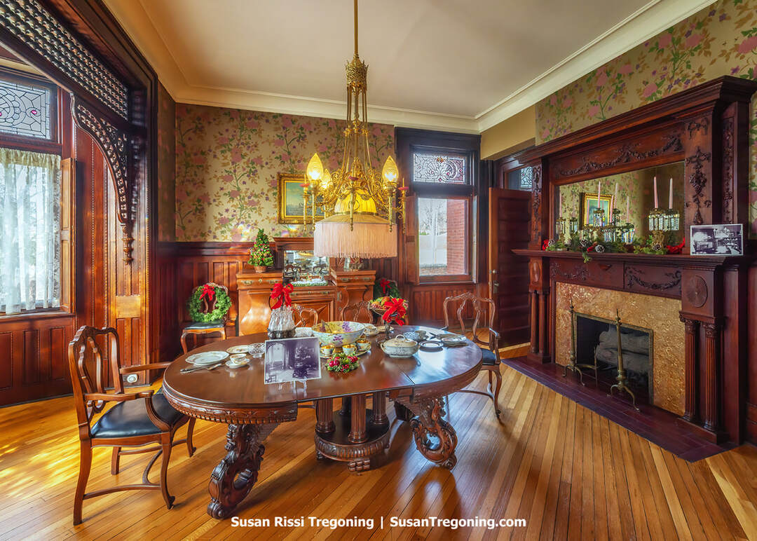 The dining room of the Howard Steamboat Museum, preserved with its Victorian furnishings, carved woodwork, and elegant period décor.