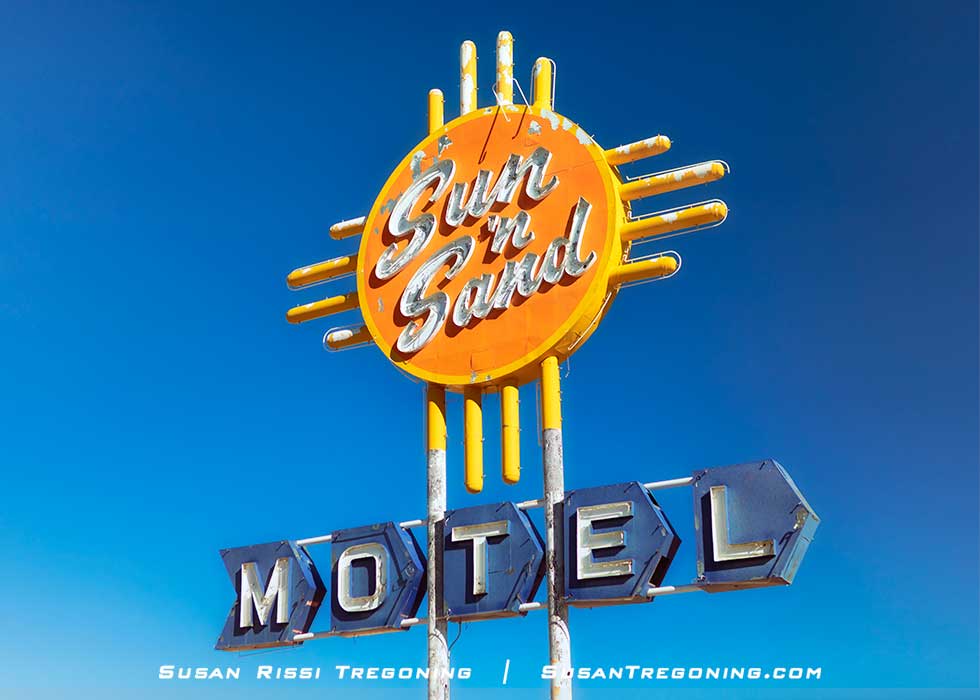 The striking Zia influenced Sun 'n Sand Motel neon sign on Route 66 in Santa Rosa, New Mexico.