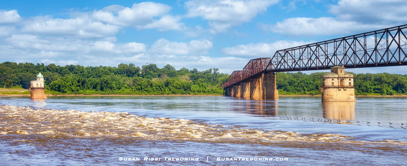 The Mississippi River is seen below the Old Chain of Rocks Bridge near the Chain of Rocks rapids and historic St Louis water intake towers. After the low water dam was installed, the Chain of Rocks shoal can no longer be seen unless the river level is extremely low.