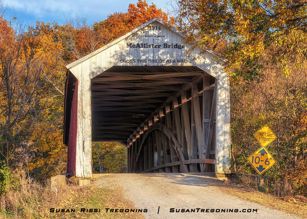 The McAllister Cover Bridge, with its distinctive “Britton Portal,” is located in Parke County, Indiana. Parke County has 31 covered bridges and is known as the “Covered Bridge Capitol of the World.”